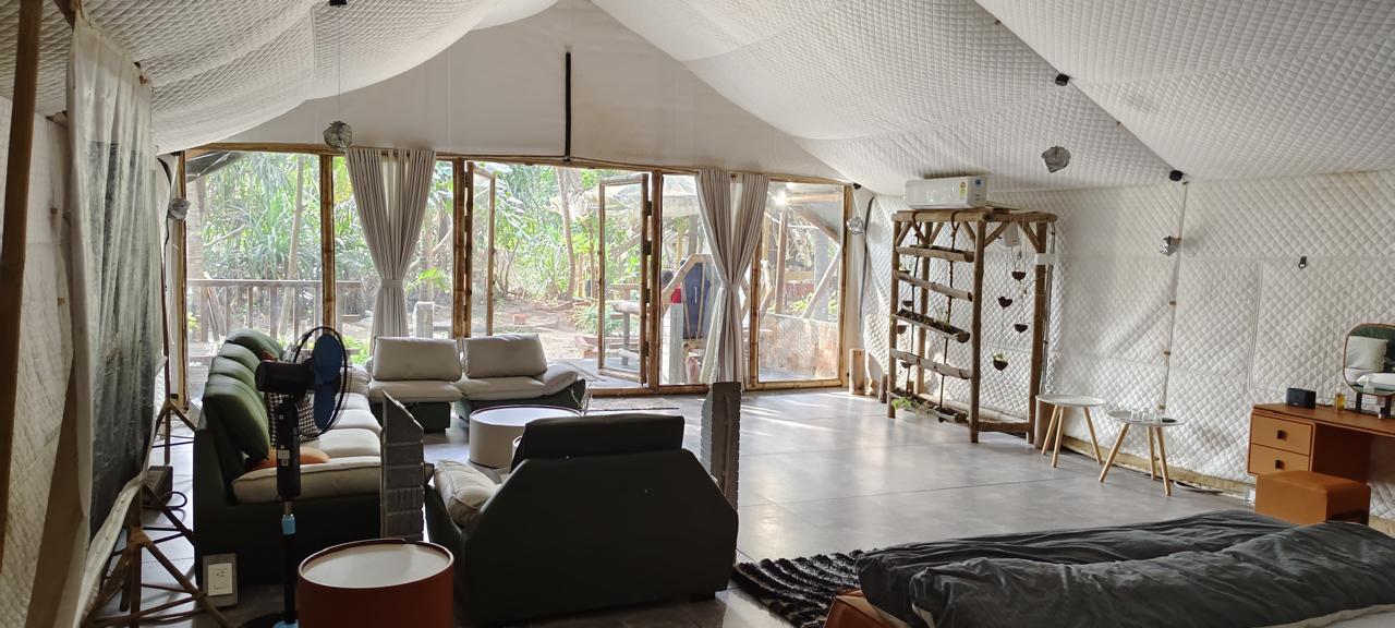 Oriental Royal Cottage - Unwind in a lavish living space adorned with elegant white sofas, premium furnishings, and exquisite oriental-inspired décor.